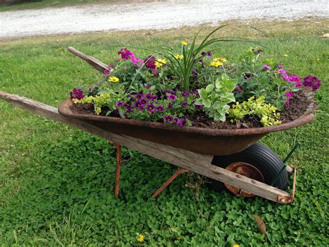 ideas for old wheelbarrows|wheelbarrow planting ideas.